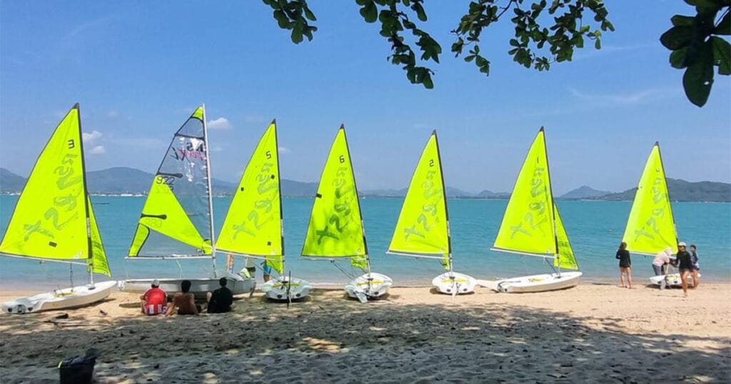 Fleet of RS Zest dinghies prepared on the beach for HeadStart International School Silver Duke of Edinburgh Award sailing in Phuket