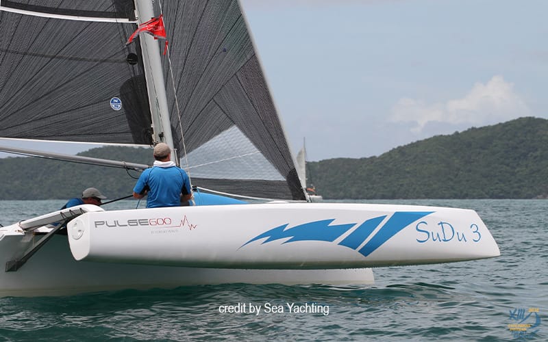 Corsair Pulse 600 performance trimaran SuDu 3 sailing on tropical waters with crew aboard.