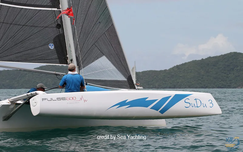 Corsair Pulse 600 performance trimaran SuDu 3 sailing on tropical waters with crew aboard.