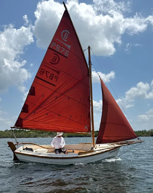 Traditional Post Boat Mandolin sailing with red sails in Krabi, Thailand