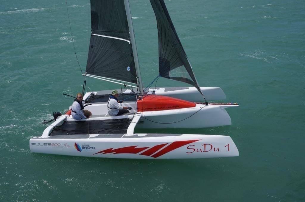 Pulse 600 performance sailing catamaran underway with two sailors aboard