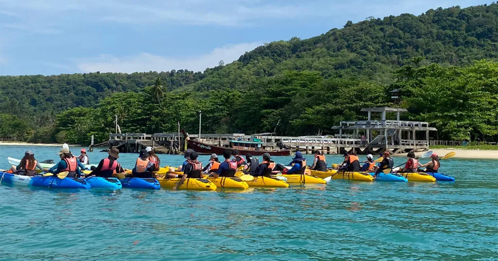 Group of students kayaking together near Koh Lon during a Java Yachting outdoor education programme in Phuket