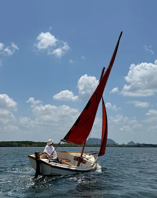 Traditional sailing boat Mandolin underway on the waters of Krabi, Thailand