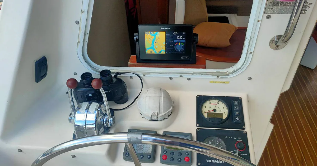 Yacht helm with chartplotter and engine controls used for Java Yachting practical boat training