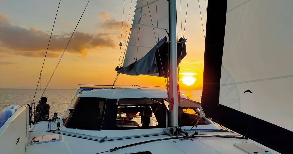 Sailing yacht underway at sunset during practical Java Yachting training in Thailand